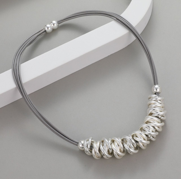 interlinked-rings-on-corded-necklace-silver