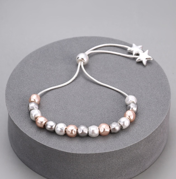 mixed-toned-balls-on-pullcord-bracelet-with-star-ends